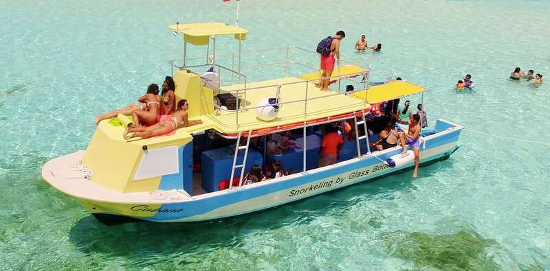 Cozumel: VIP Glass Bottom Boat & Snorkeling 3 Reefs Tour - The boat setup: comfortable rides, a sundeck for photos, and glass-bottom reef viewing