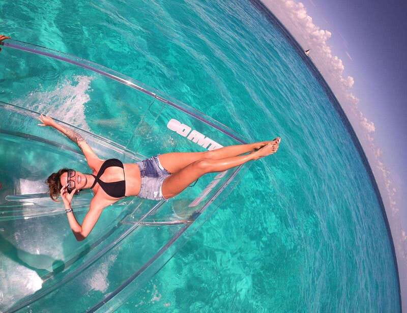 Explore the sea of cozumel in a transprent boat with drinks and snorkel. - The underwater highlights you’ll be watching for