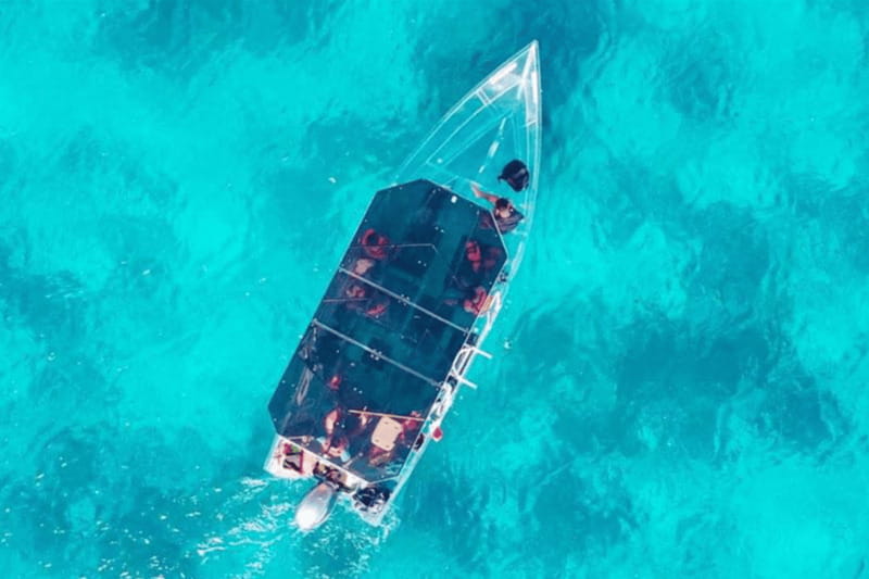 Explore the sea of cozumel in a transprent boat with drinks and snorkel. - Where you start: Envatours Cozumel and the San Miguel angle